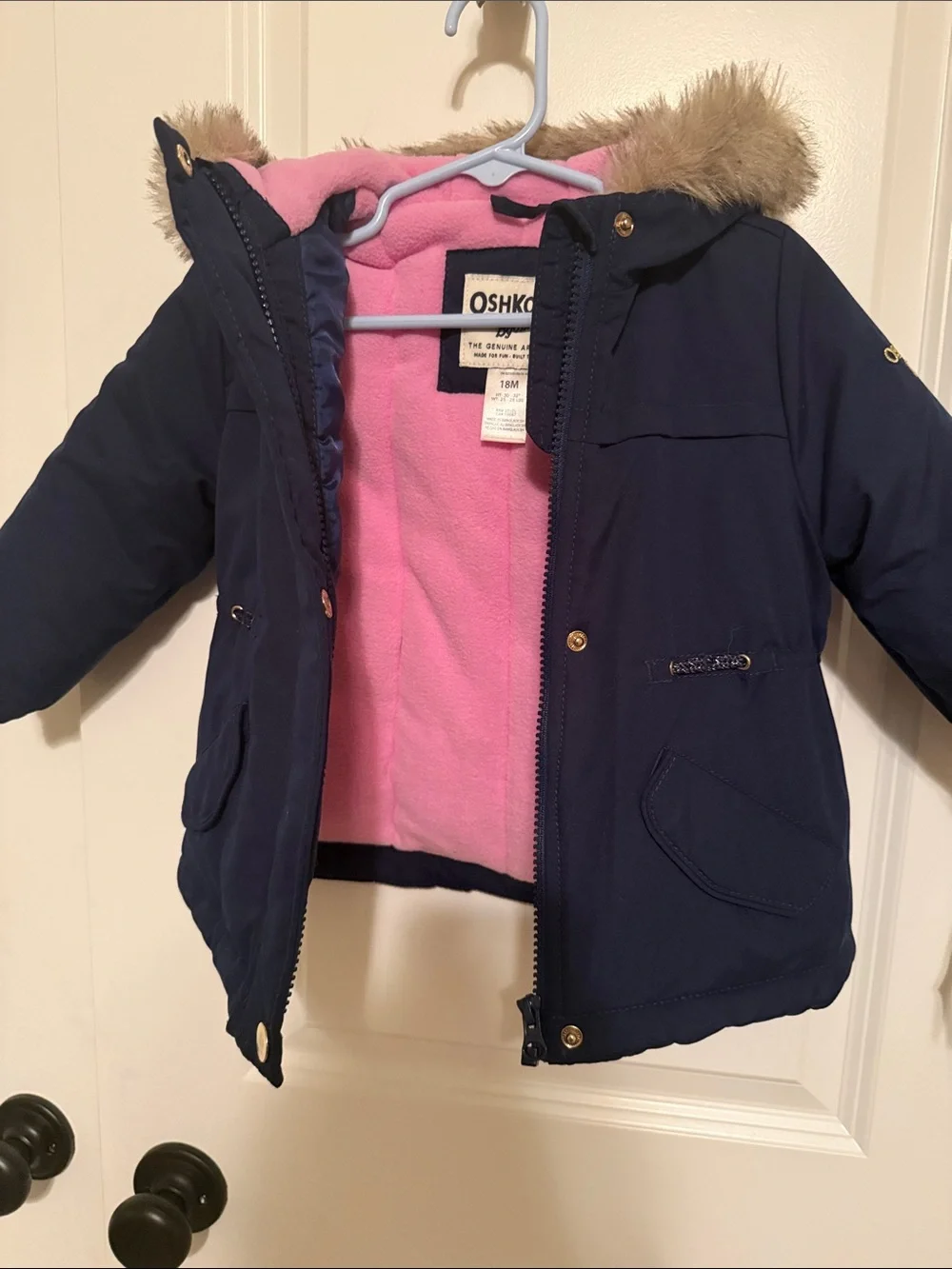 Girls winter coat with hood. Navy blue outside with pink fleece inside